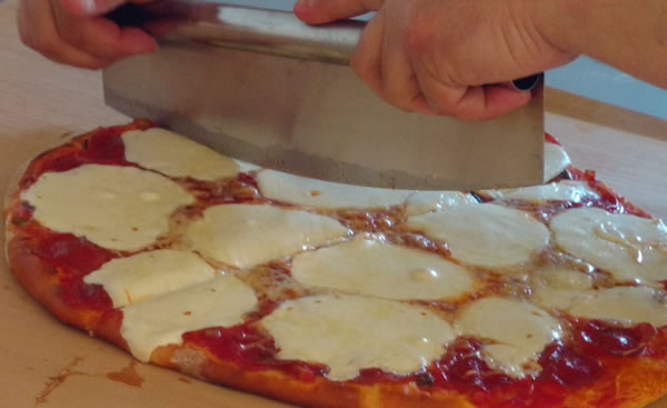 Cutting Pizza made with dough from bread machine